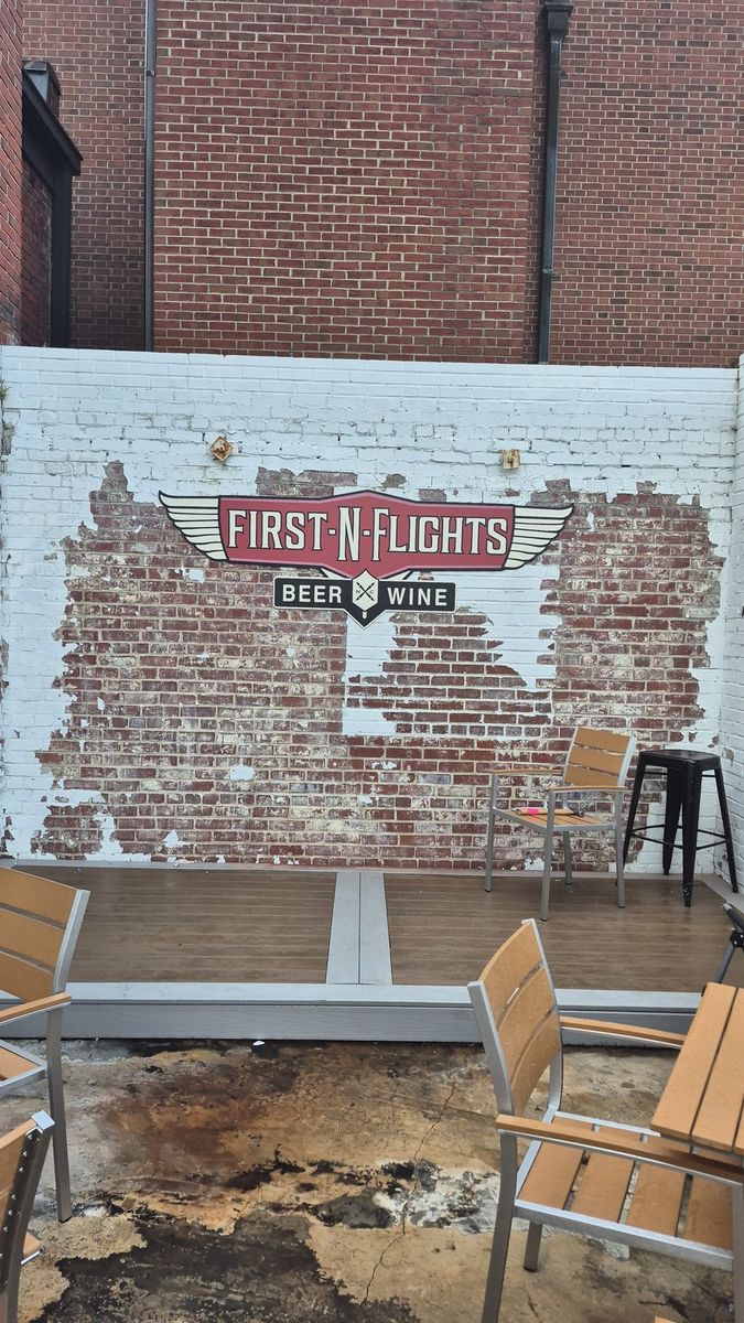 First-N-Flights Taproom patio with Purple Star Signs-installed wall sign, District Exchange Concord NC