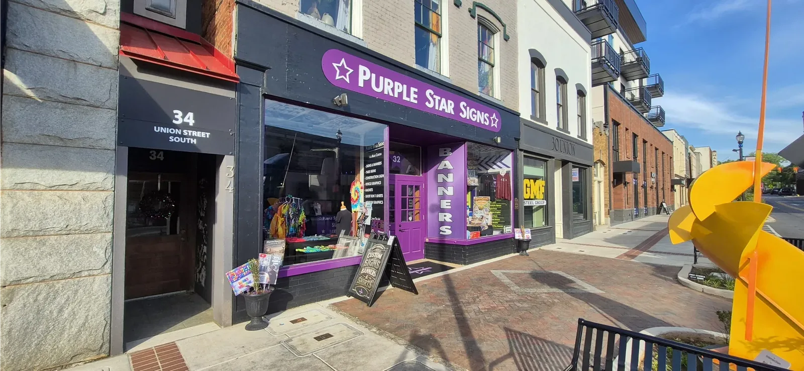 Purple Star Signs storefront at 32 Union St S, Concord NC